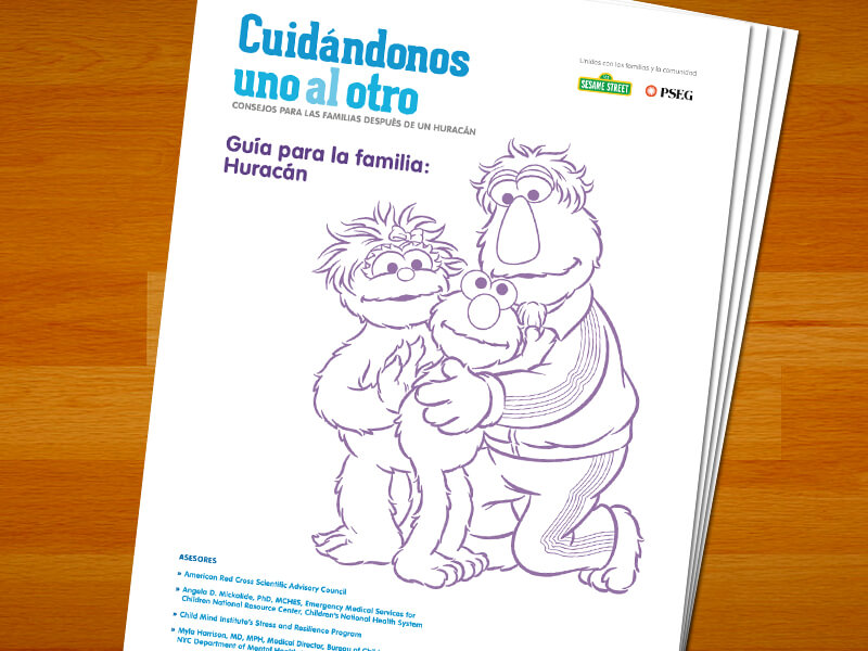 Guia para la familia: Huracan. Elmo abrazando a sus padres.