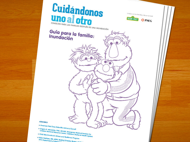 Guia para la familia: Inundación. Elmo abrazando a sus padres.